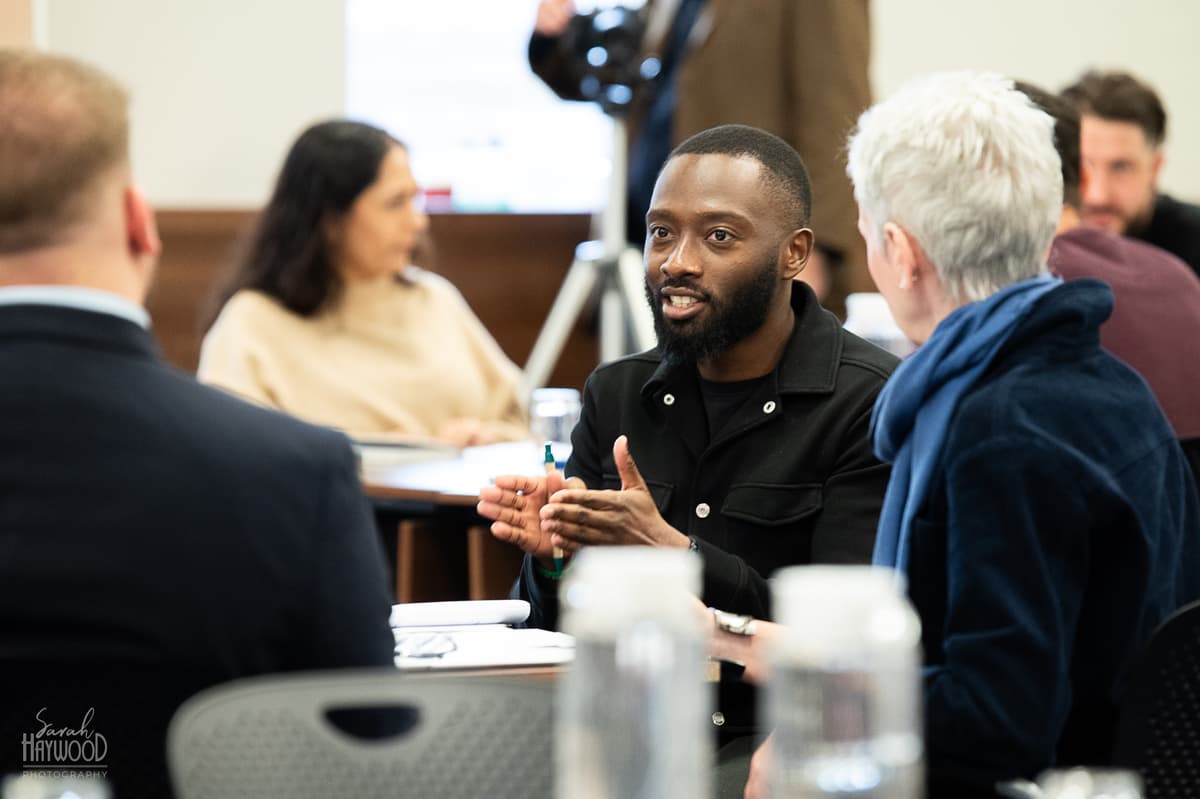 Luke Daniel delivering experience-led sales training to a group of professionals in an interactive workshop session